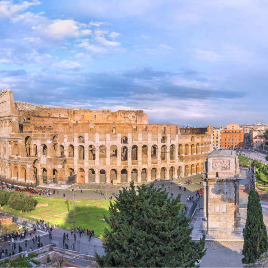 Amazing aerial panoramnic view on the Great Roman Colosseum ( Coliseum, Colosseo ,also known as Flavian Amphitheatre ) at sunset. Famous world landmark. Scenic urban landscape. Rome. Italy. Europe