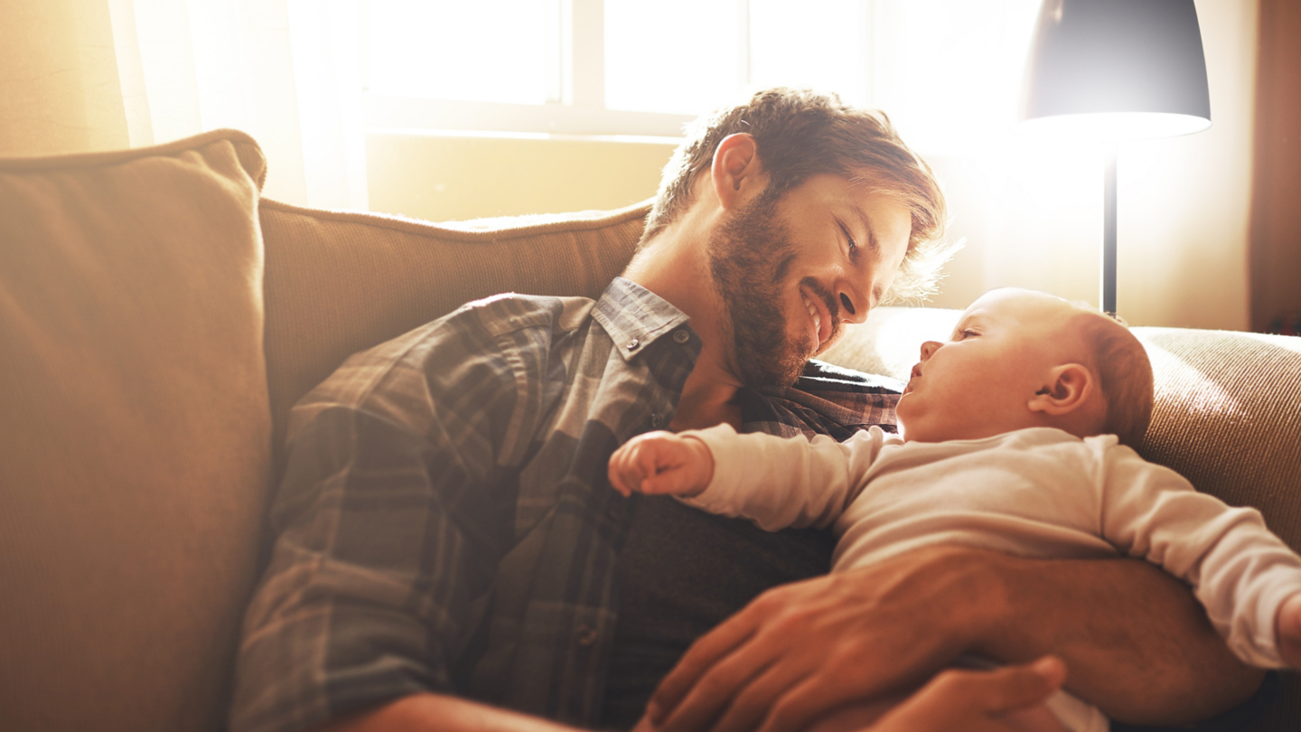 I promise you, Ill always be around. a young father and his baby boy in the living room