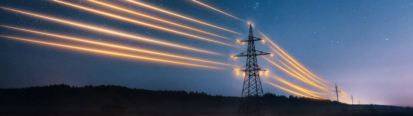 Electricity transmission towers with orange glowing wires the starry night sky. Energy infrastructure concept.