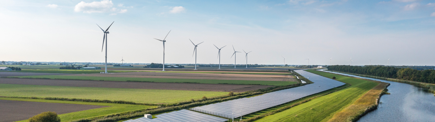 Solar panels and wind turbines generating renewable energy for green and sustainable future.