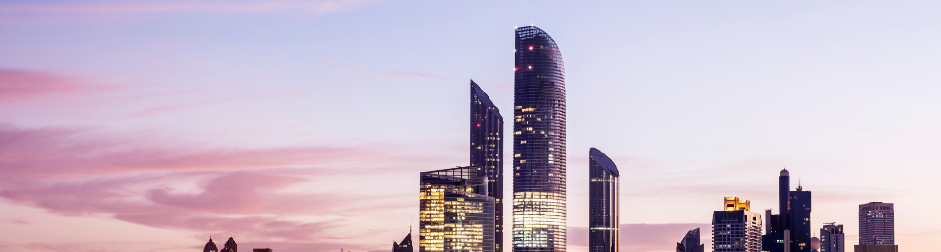 Panoramic view of the Abu Dhabi city skyline at twilight, United Arab Emirates