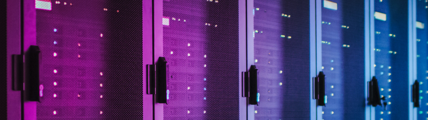 Shot of Dark Data Center With Multiple Rows of Fully Operational Server Racks. Modern Telecommunications, Cloud Computing, Artificial Intelligence, Database, Supercomputer. Pink Neon Light.