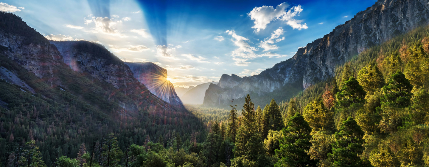 mountains with clouds and sunrise reflecting sustainable future