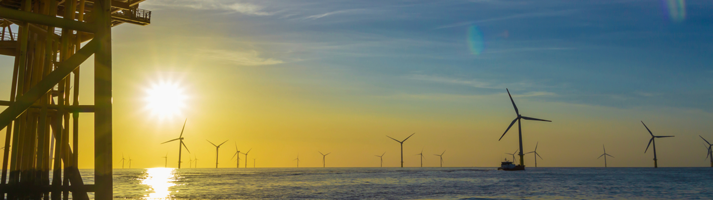North Sea offshore wind farm substation and the sunset