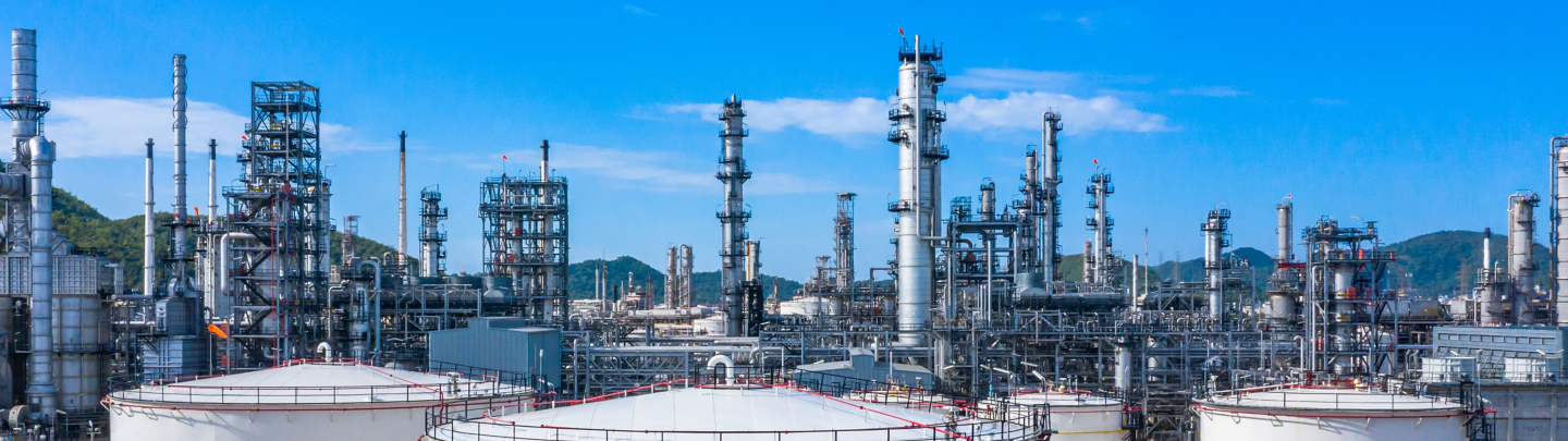 Oil​ refinery​ and​ petrochemical​ architecture plant industrial with blue sky background, White oil and gas refinery tank, Oil refinery plant from industry zone business power and energy petroleum.