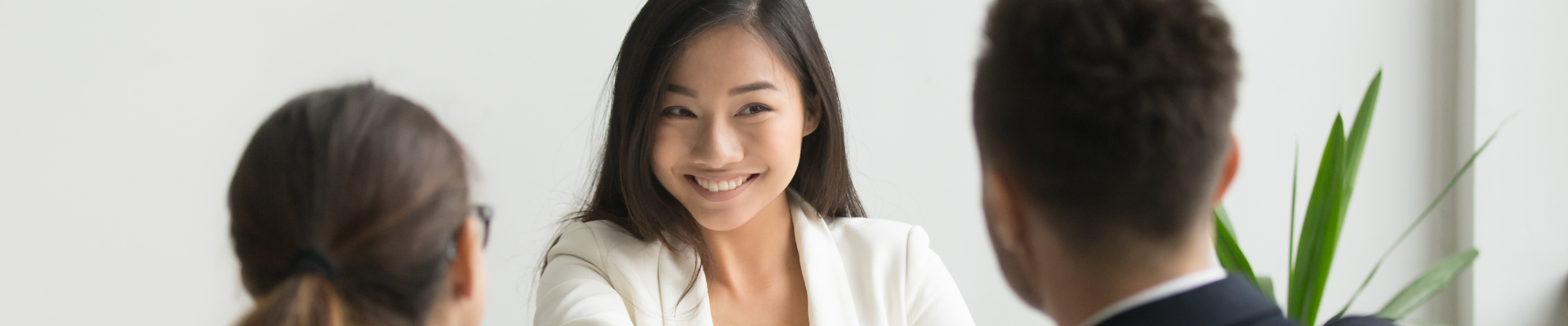 Happy millennial asian applicant getting hired shaking hand of hr, employer handshaking successful smiling chinese candidate congratulating with job interview win offering employment contract concept