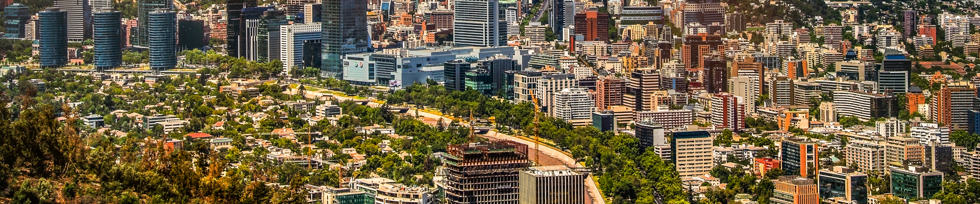 View of Santiago de Chile with Los Andes mountain range in the back at sunset time